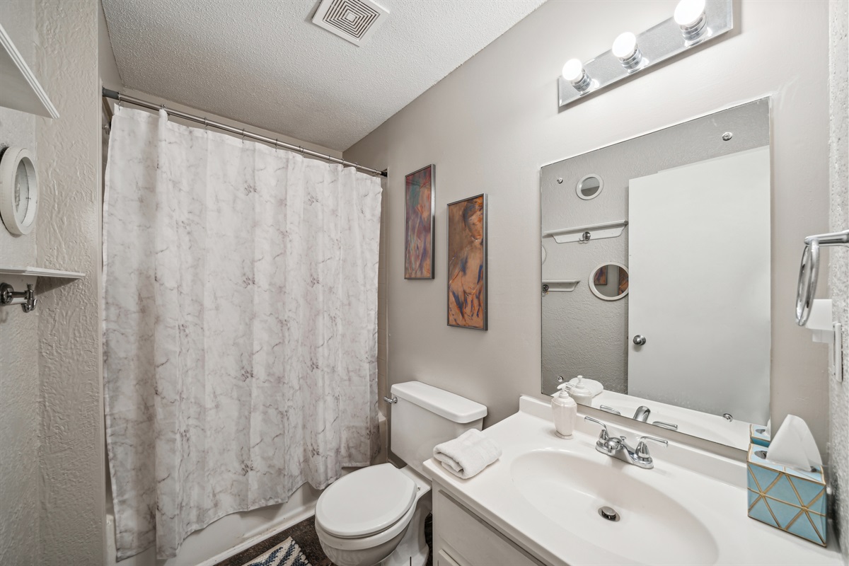 The upstairs bathroom offers a full tub/shower.
