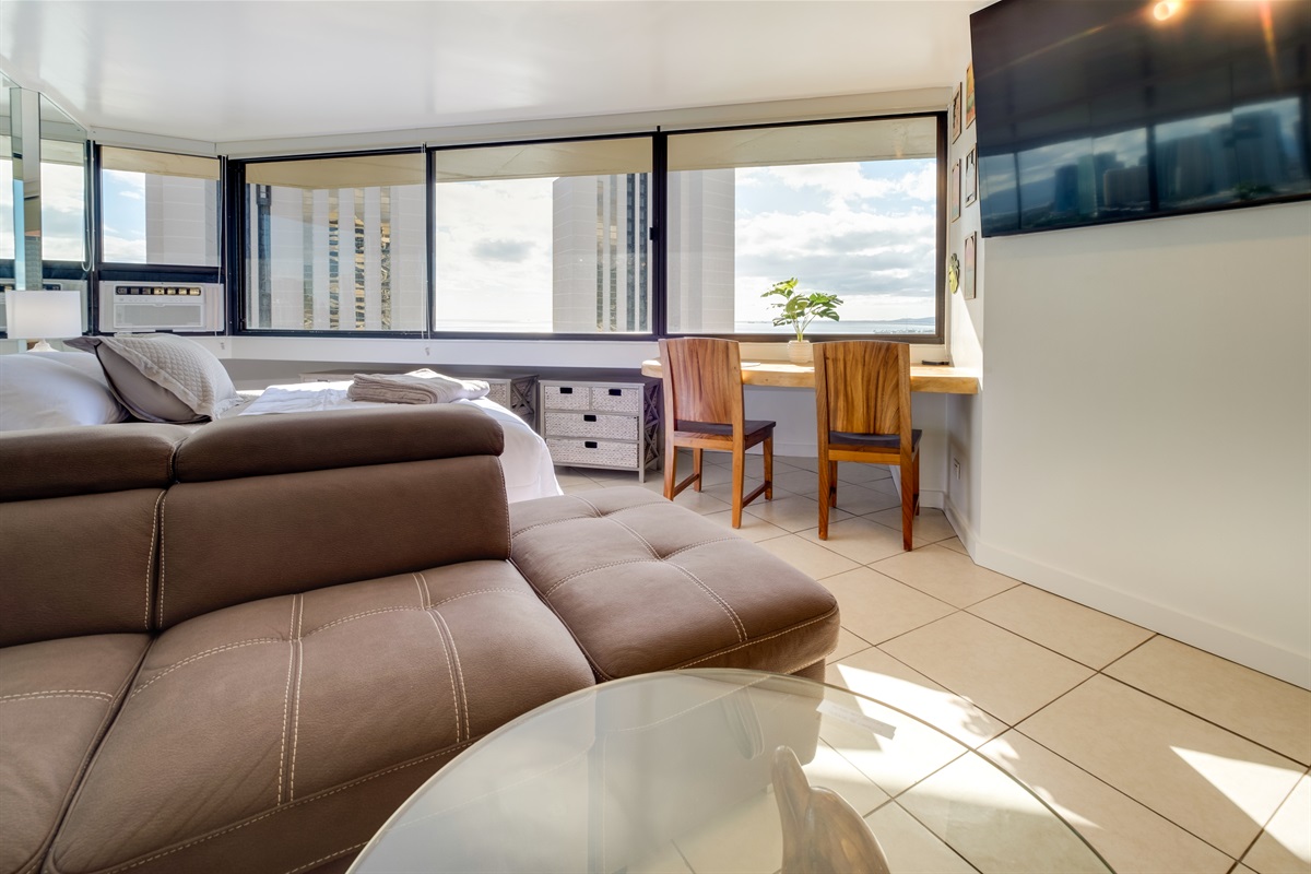 Start your morning with island sunshine and skyline views — this inviting corner of the suite is perfect for sipping coffee, catching up on work, or simply soaking in the beauty of Waikīkī. Bright, modern, and designed for relaxation, it’s where paradise m