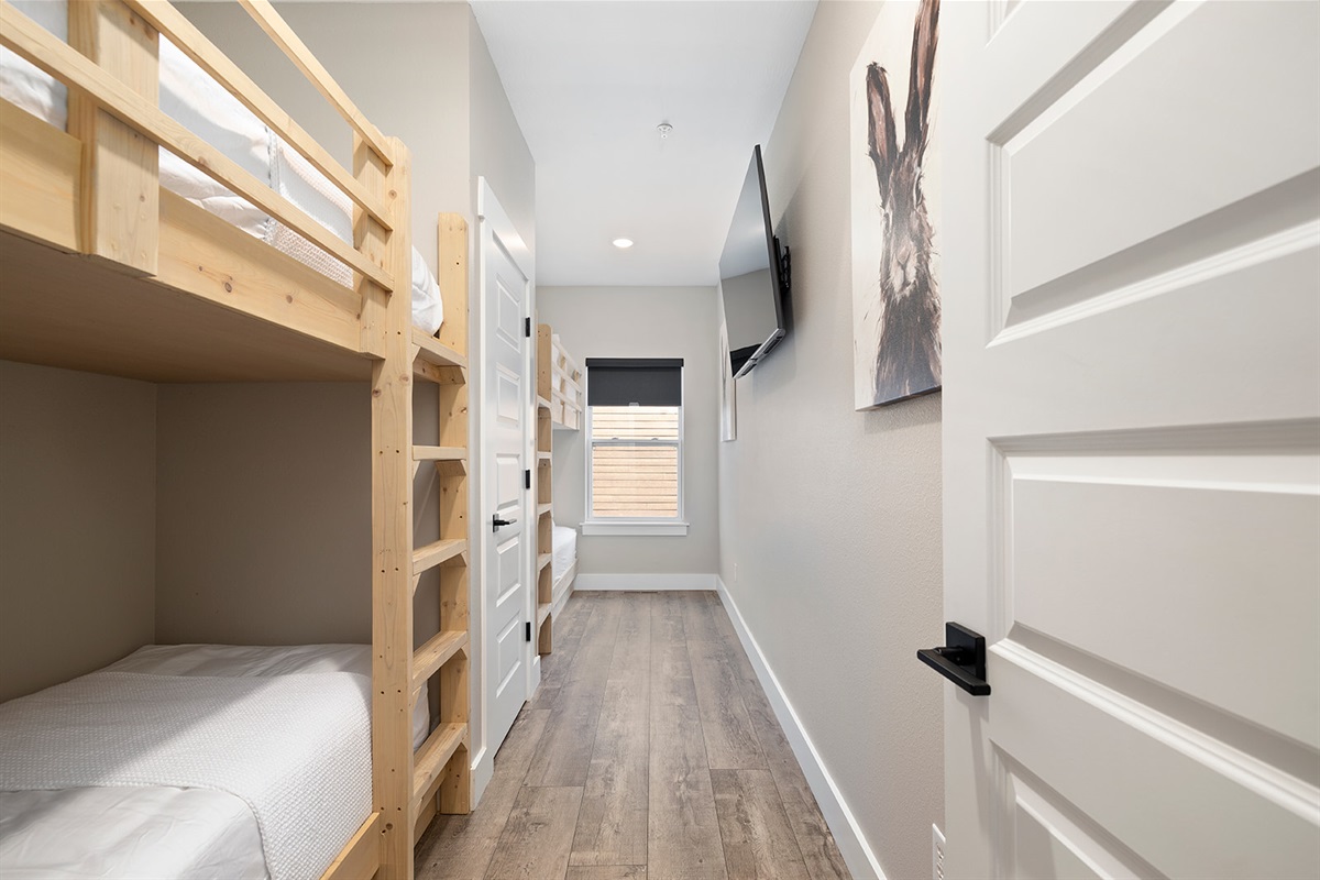 Main level bunk room with 4 twin beds