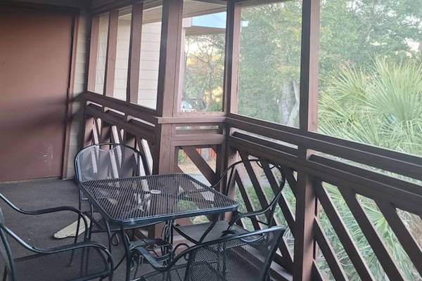 Enclosed back private porch overlooking outdoor pool. 