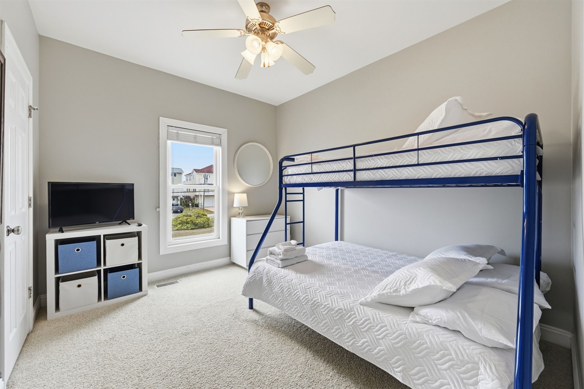 Fun bunk room with twin over double setup for kids or extra guests
