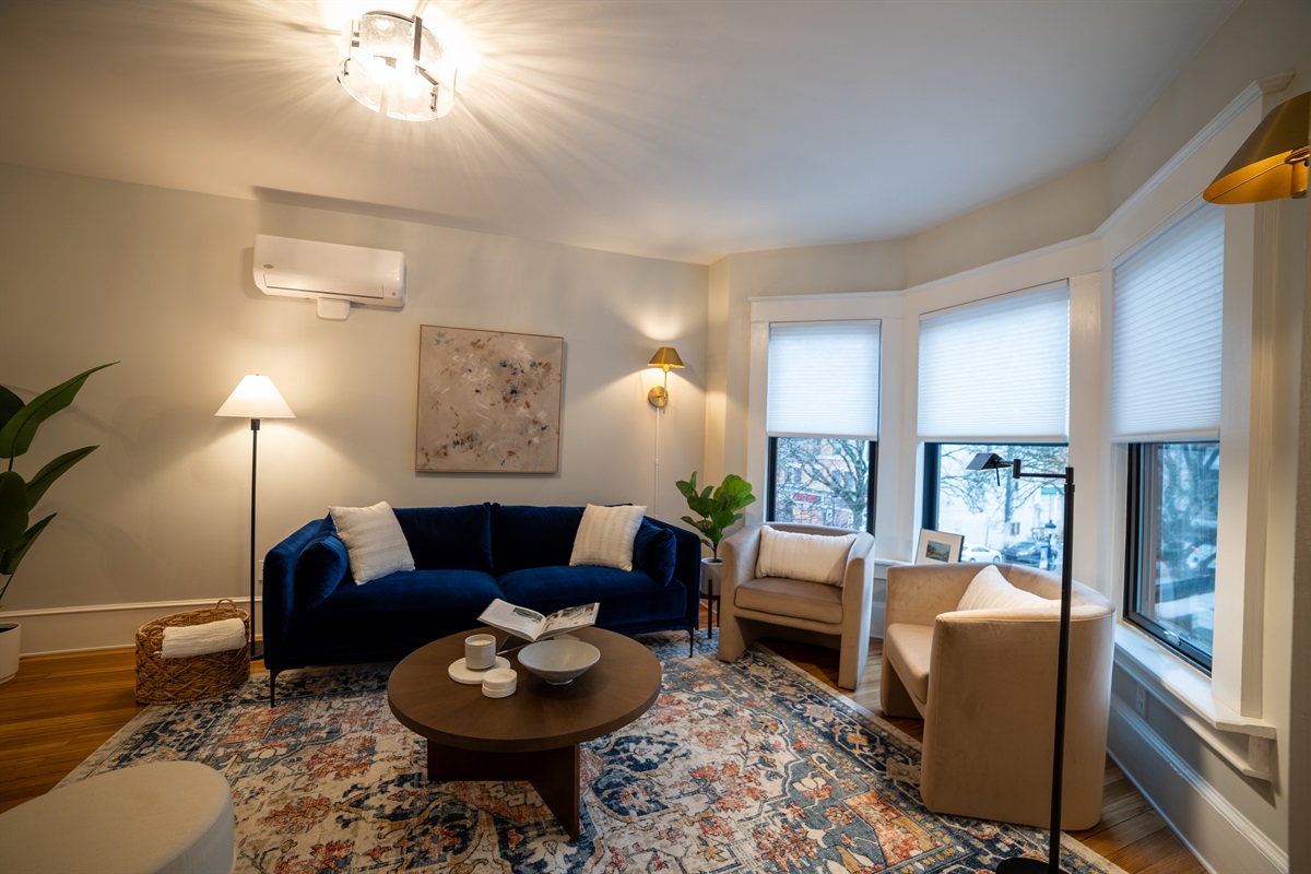 Large living room with views of Main Street. 