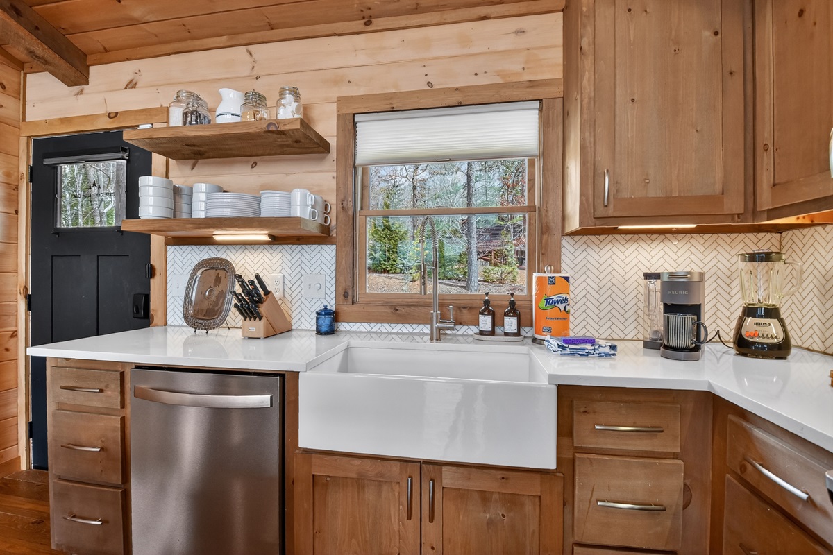 Fully stocked kitchen directly inside the entry door