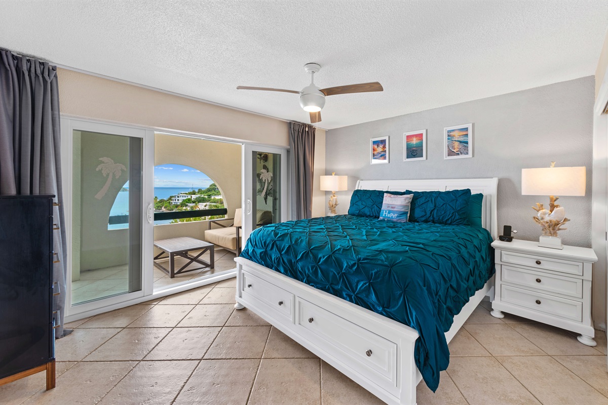 The primary bedroom offers a king-size bed and coastal accents for restful nights.