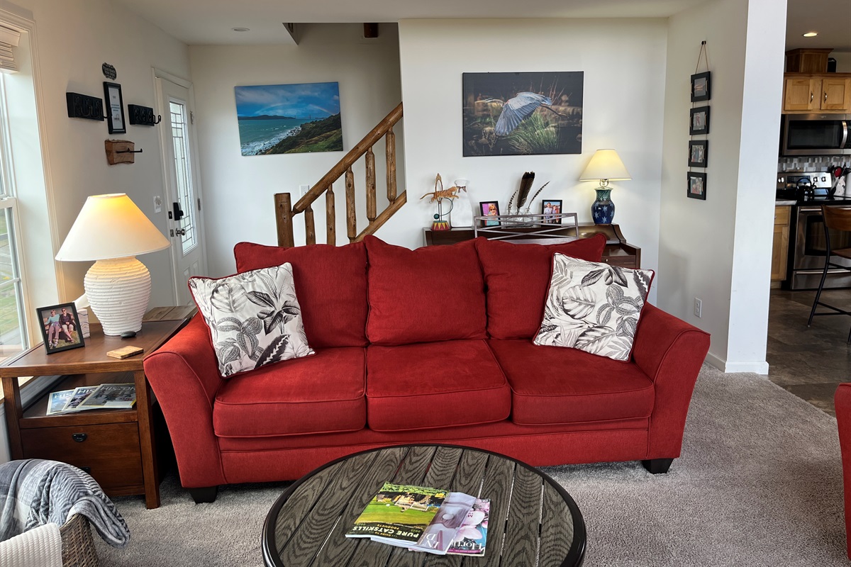 Living area with stairs to game loft