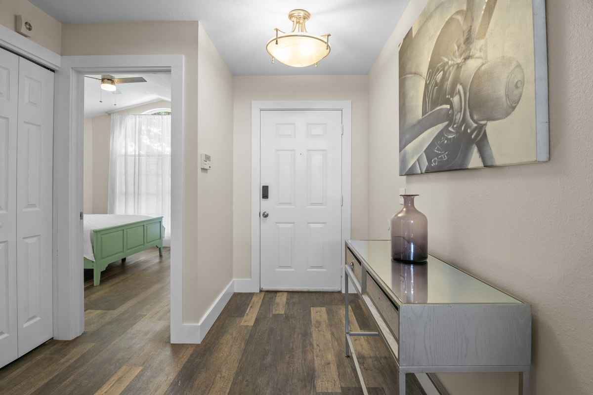 Front entry door & foyer. Storage Closet.