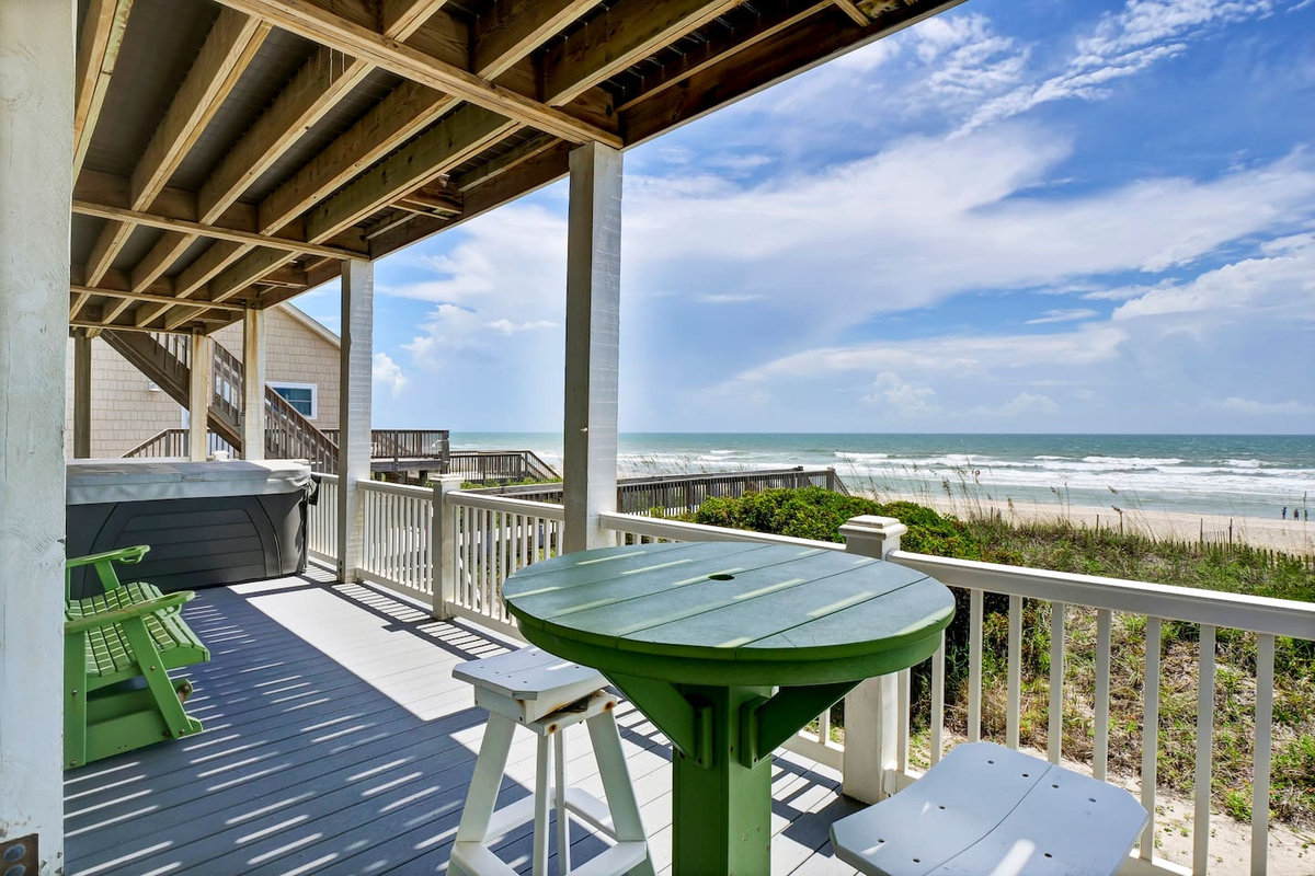 This mid-level balcony can be accessed by either the stairs along the side of the home, or by each of the bedrooms on this level - Bedrooms 1, 2, & 3