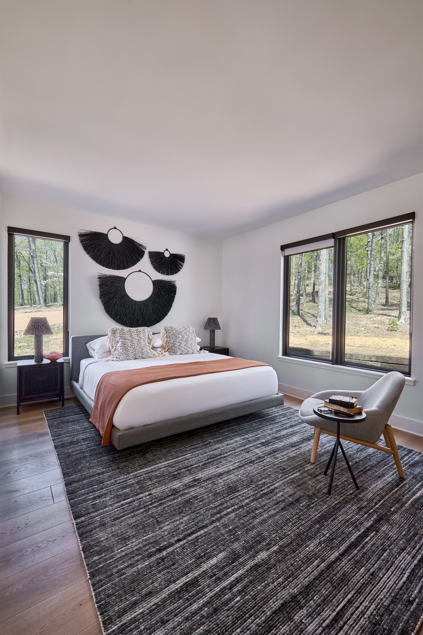 A king bedroom with woodland views and artistic flair, designed for rest, warmth, and style.