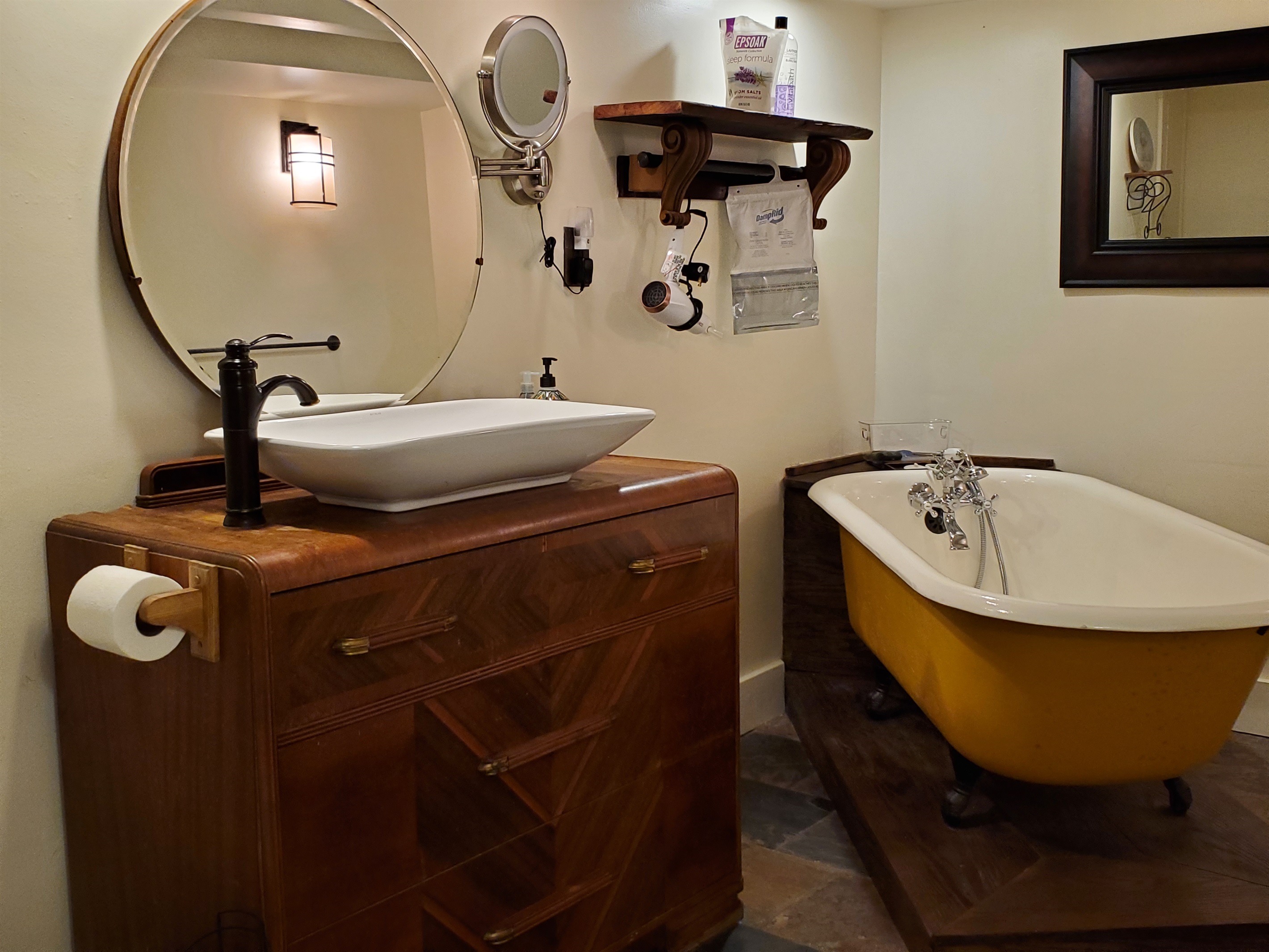 Bath w/ vintage clawfoot tub on lower level next to game room