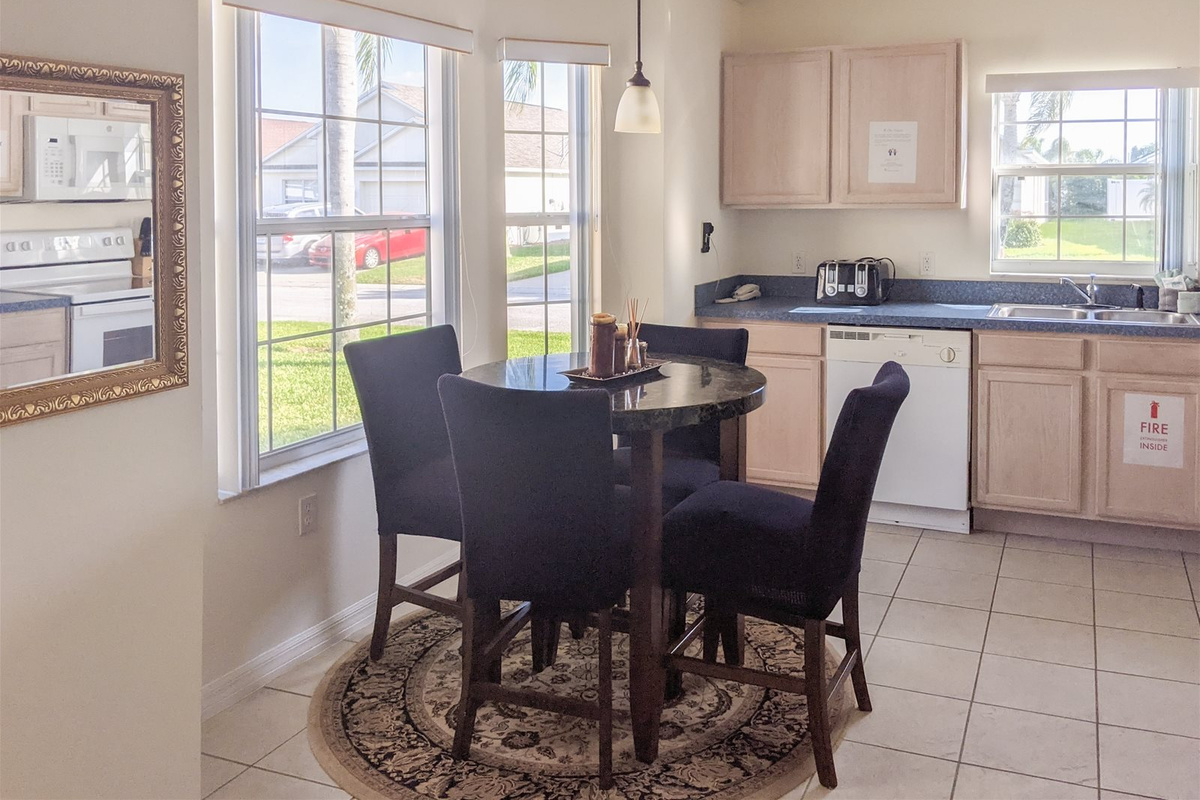 Fully stocked kitchen with a breakfast nook.