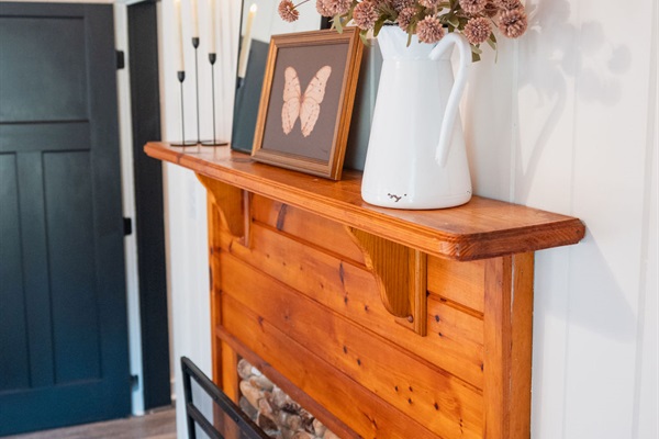 Drift off beside the glow of your own fireplace &mdash; a quiet, comforting retreat at the heart of the cabin.