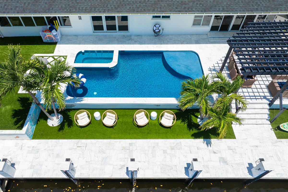 Experience waterfront luxury in the daytime&mdash;relax by the sparkling heated pool, bask in the sun, and take in the serene views of the Intracoastal from your private oasis.