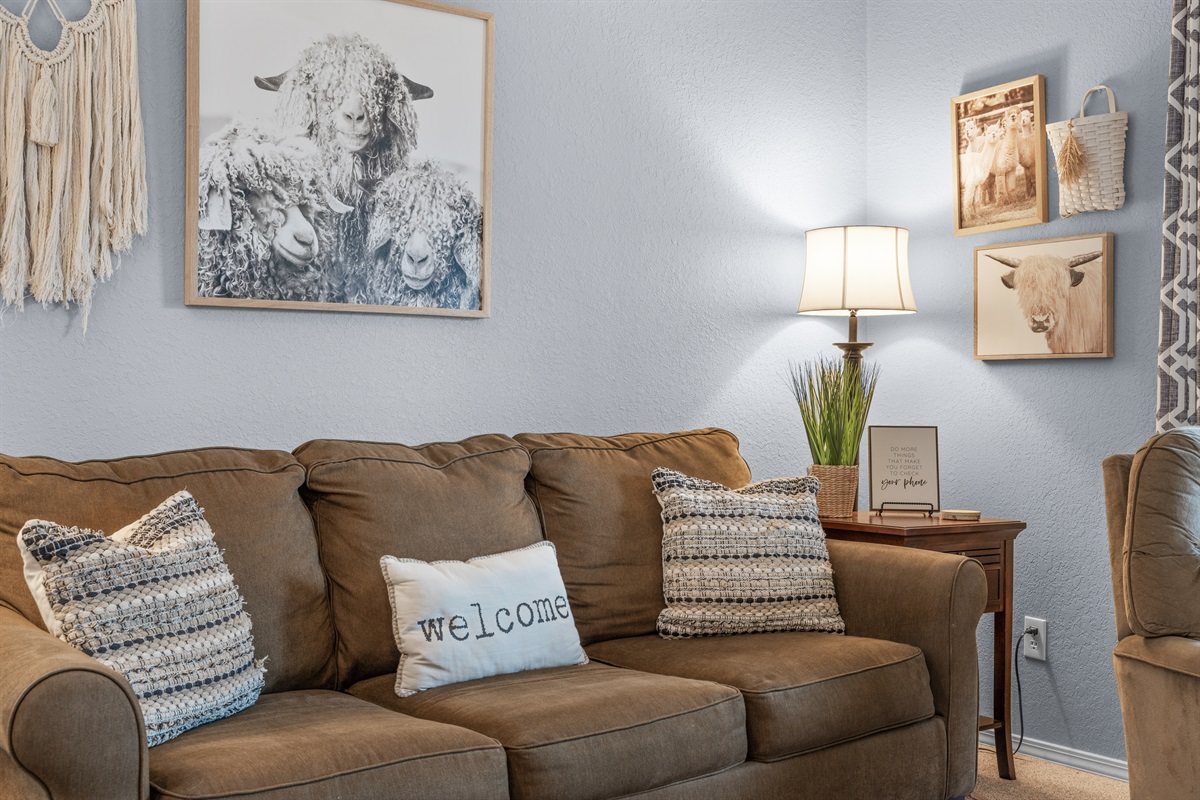 Comfortable seating and warm touches make the living room feel easy to settle into.