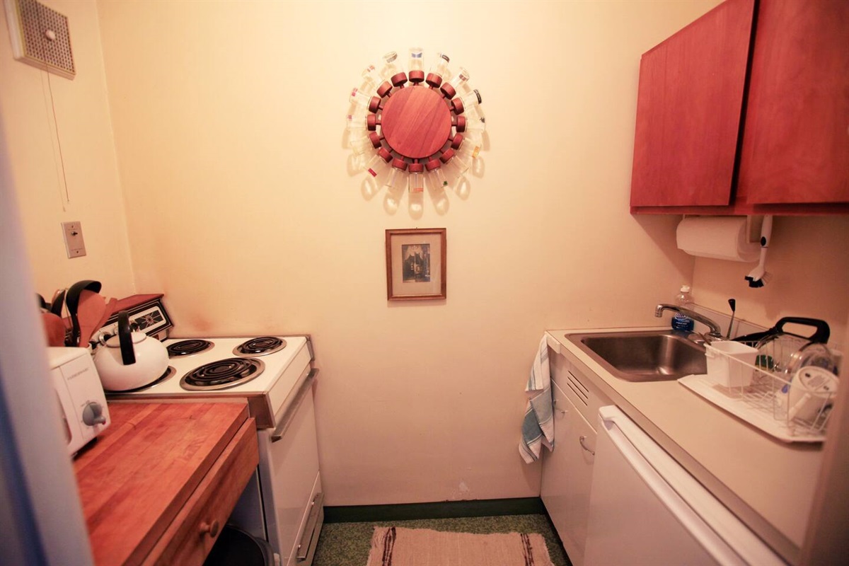 Kitchenette Equipped with Stove, Oven, Mini Fridge, Microwave, Coffeemaker, Sink, & Toaster