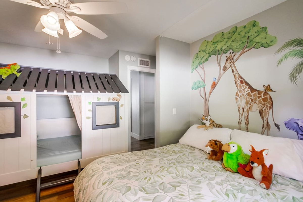 Safari Park Bedroom two queen beds and a play kitchen