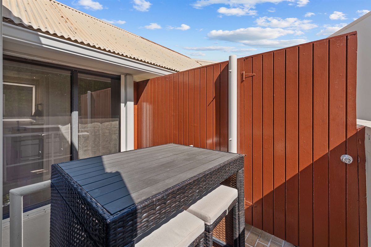 A small balcony located off of the guest bedroom