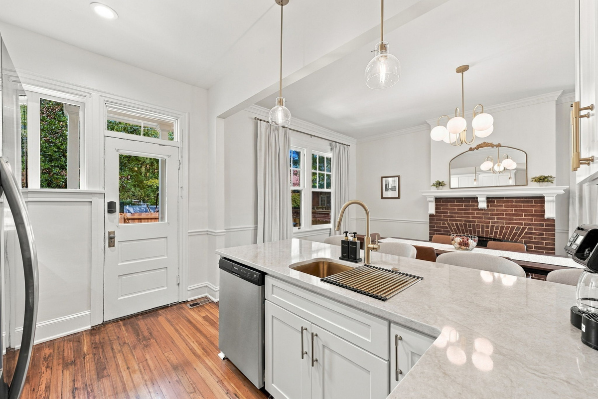 Kitchen Haven: Sleek countertops and sunny views make cooking a delight in this elegant space!