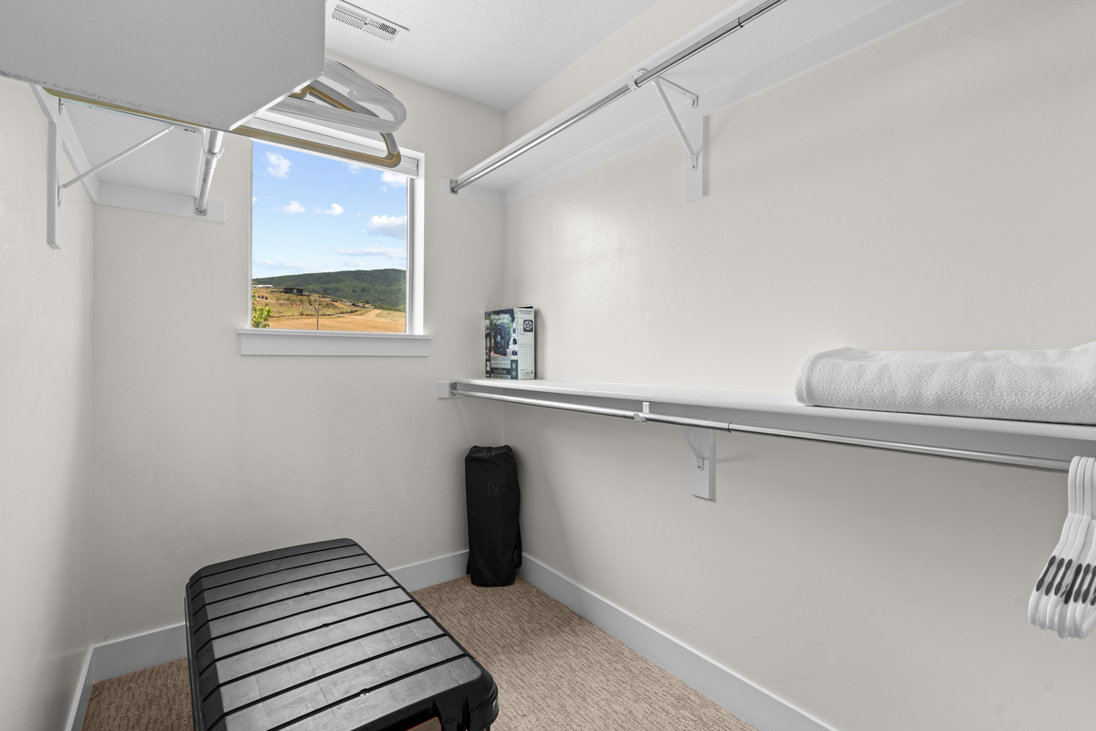 Walk-in closet with a view in the second bedroom.