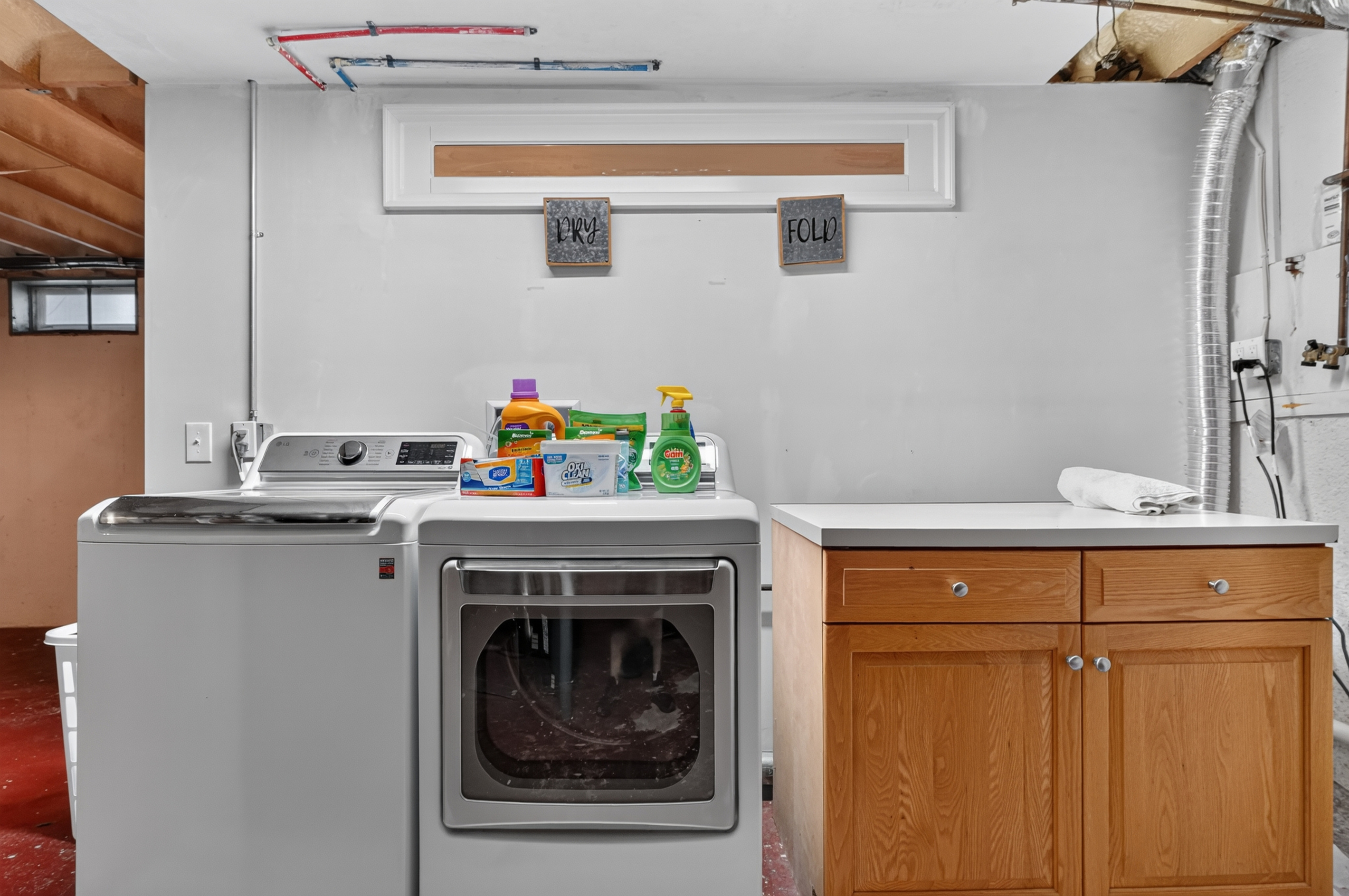 Full-size washer and dryer with complimentary laundry essentials for your convenience.