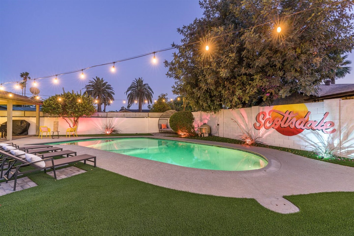 Absolutely incredible back yard features large pool with Baja step; covered patio with dining table; putting green; gas fire pit;  sun loungers; Giant Jenga; and corn hole. Pool can be heated for an add'l fee.