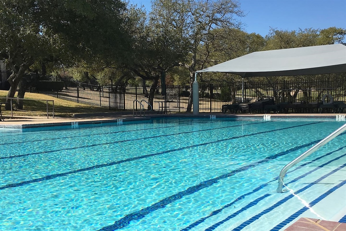 The gated neighborhood swimming pool includes lap lanes, canopied recliner seating.  Pool card key, pool towels and pool noodles provided.