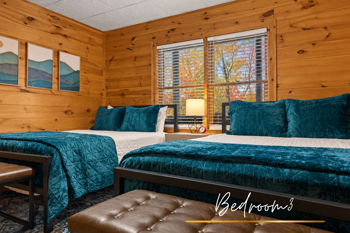 Twice the comfort, twice the charm... two queen beds wrapped in rustic wood and chic details.