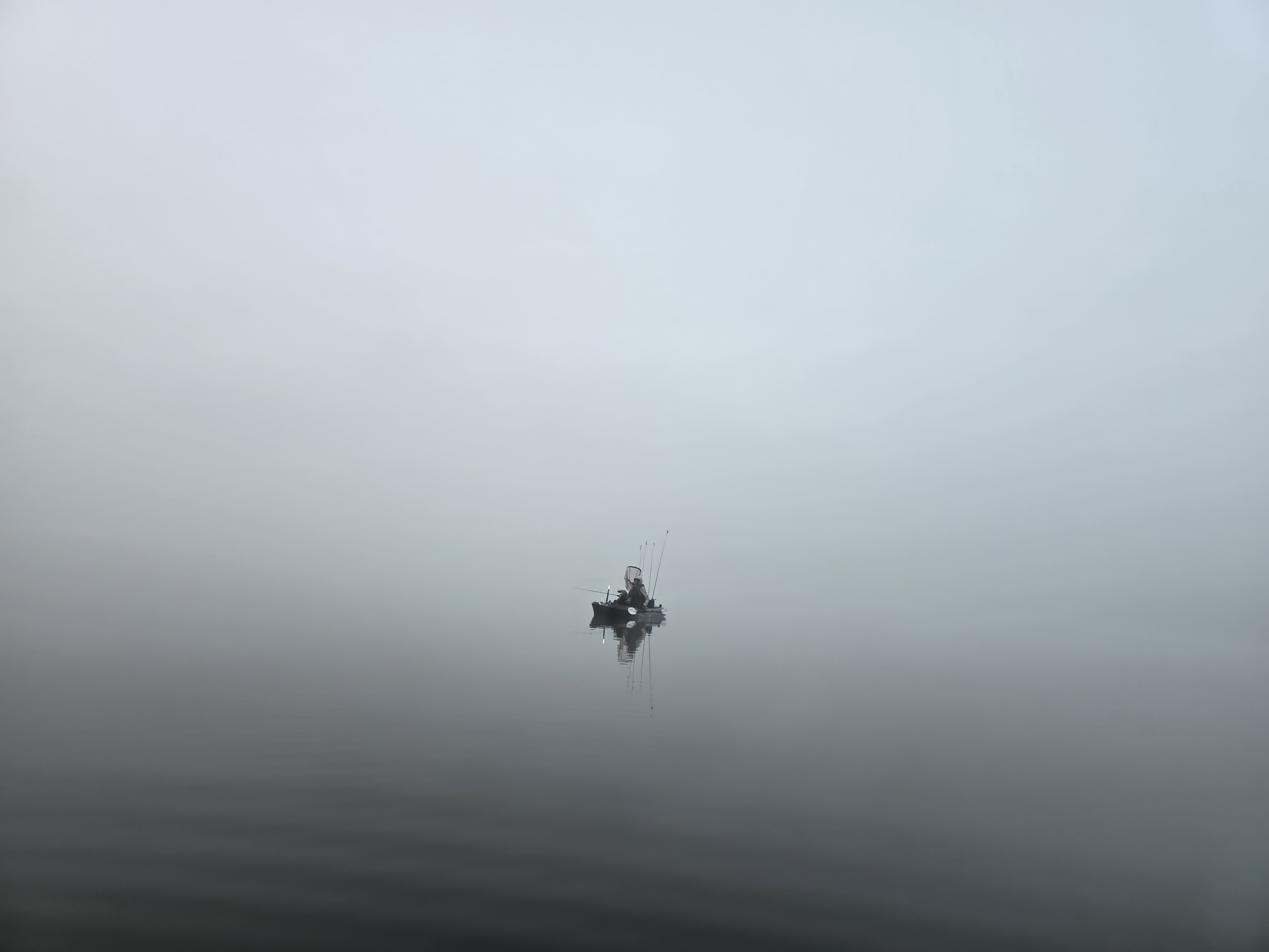 Before sunrise on Windfall Lake: mist hanging over the glass-calm water, kayak fishing for bass, pike, walleye, crappie, and perch, right from your backyard!