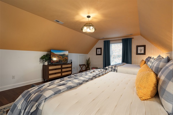 A bright and cozy upstairs retreat with two plush king beds — perfect for families or friends