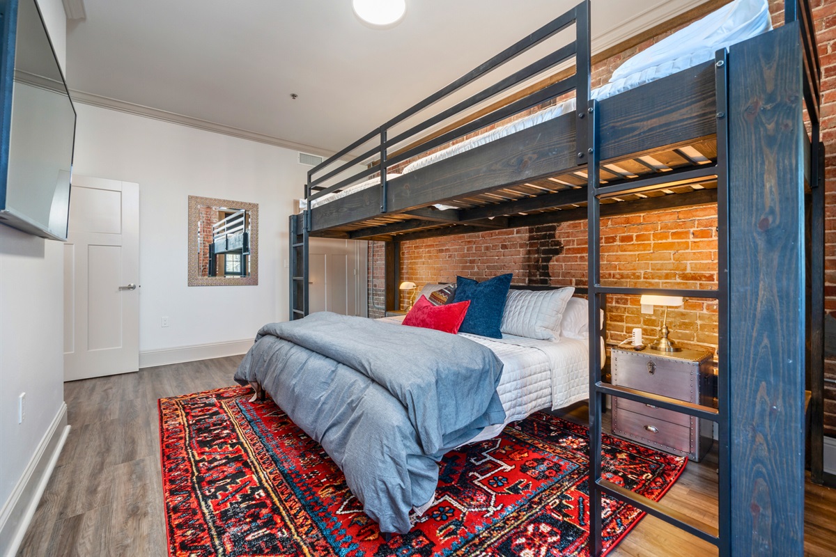 [Bedroom] Spacious Second Bedroom with Bright Lighting and Cozy Bedding