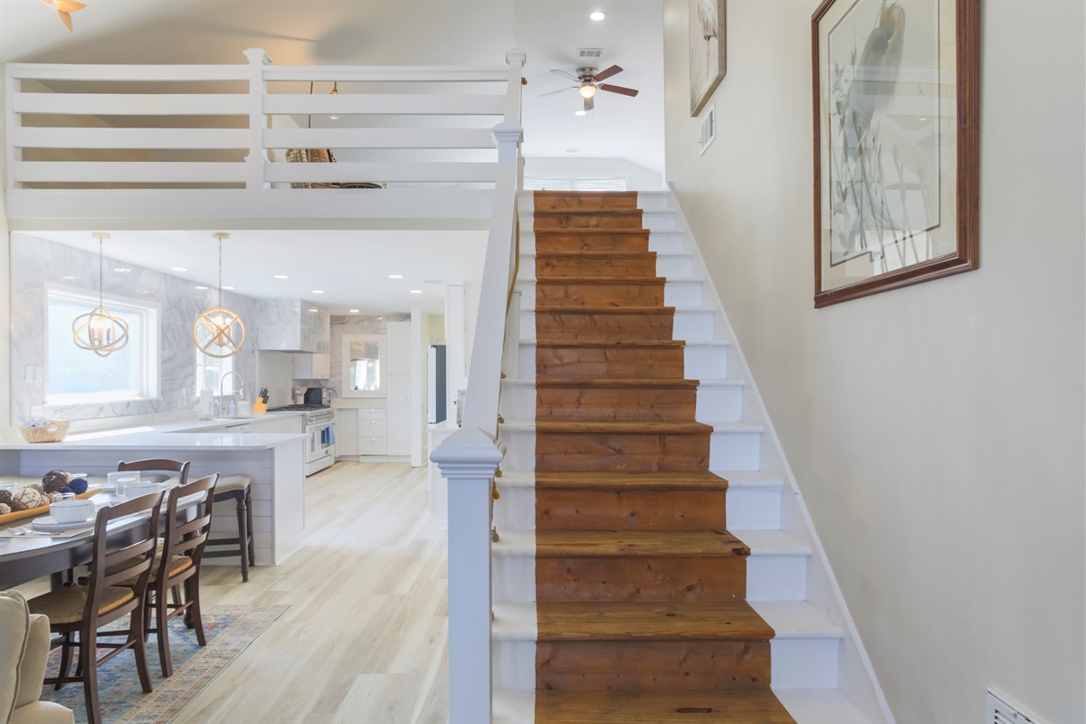 Charming staircase leads up to the cozy loft retreat.