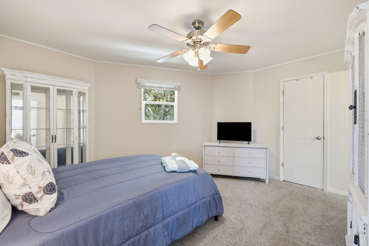 Relax in this spacious bedroom with a double bed, dresser, and wardrobe for your stay