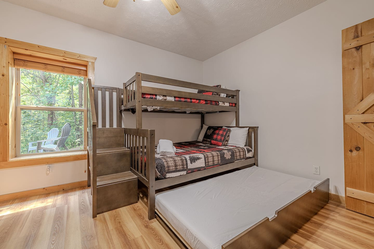 Family-friendly bunk room featuring a twin-over-full bunk with a convenient twin trundle-perfect for kids and groups. 