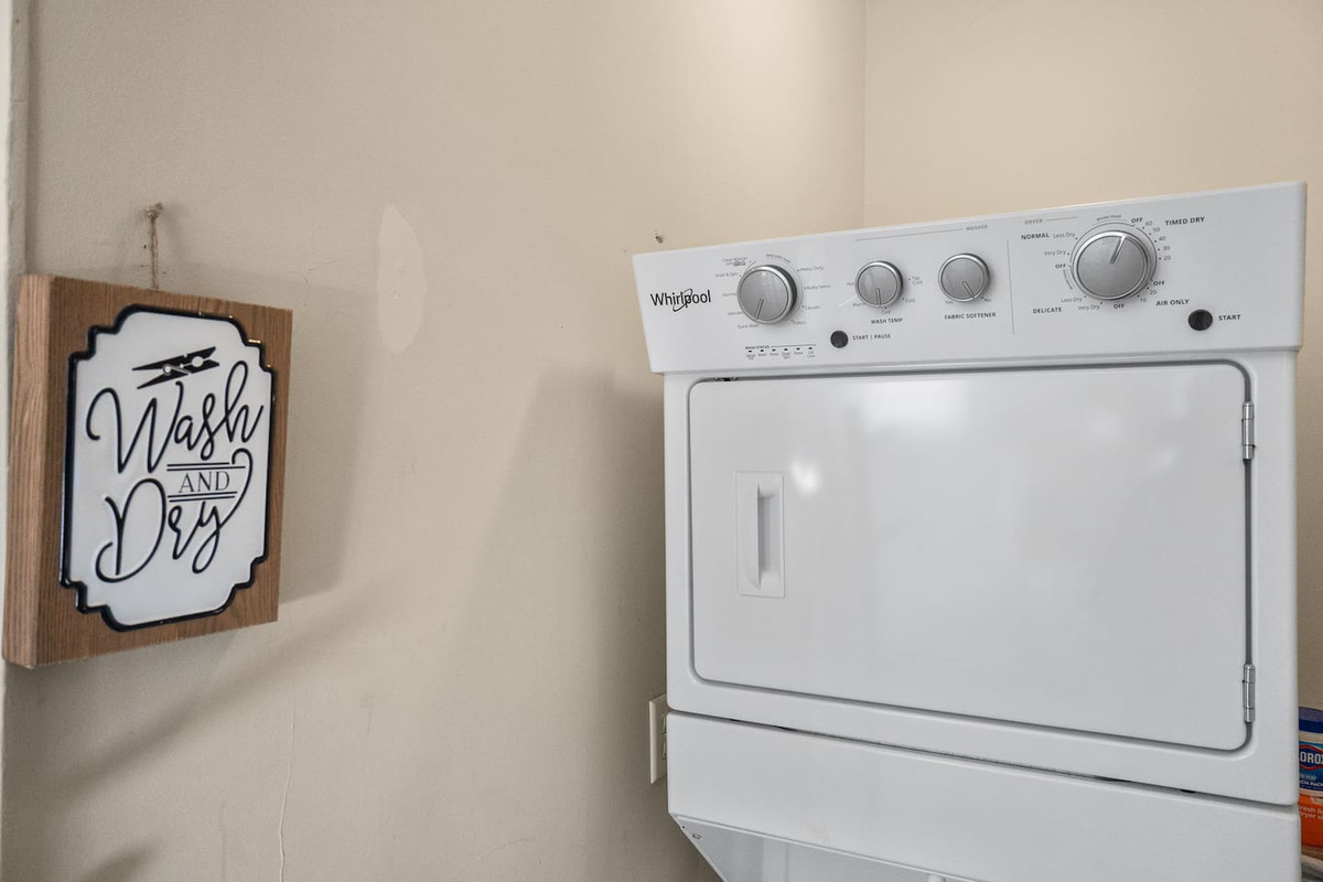 Convenient in-unit laundry area for a hassle-free stay.
