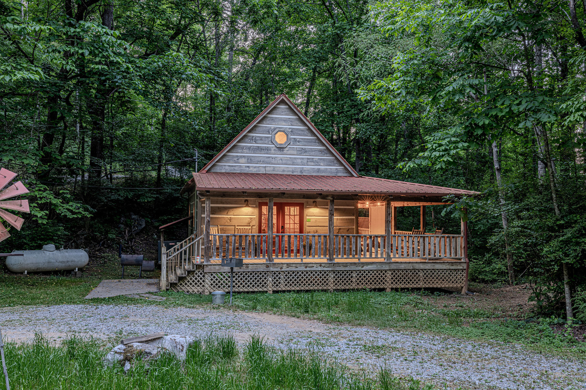 Surrounded by trees and lit up just right inside.
