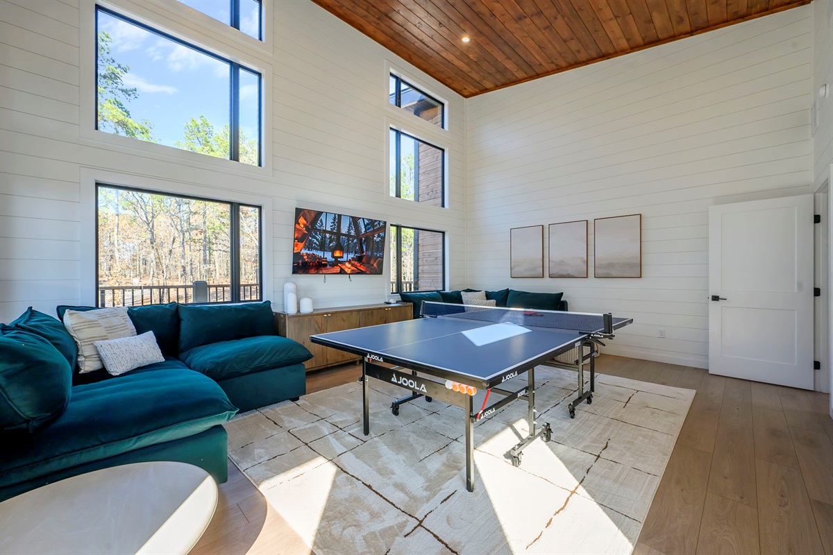 Game Room - Includes a full-sized ping-pong table + board games + Smart TV. Paddles and balls are included.