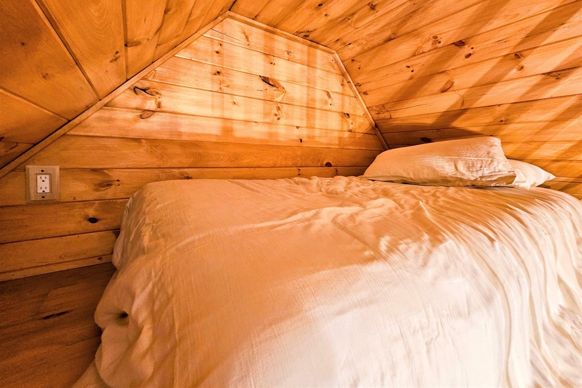 Bed in the loft of the Bunk House