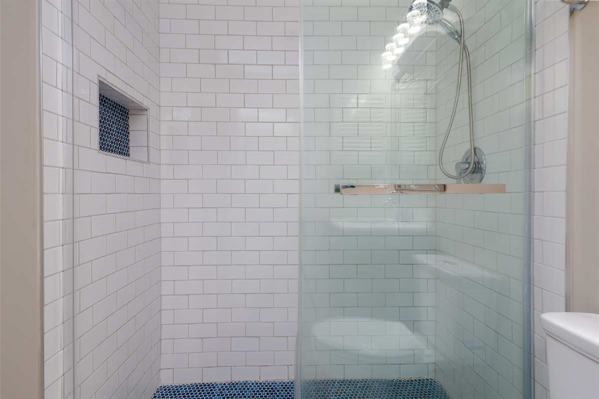 A modern bathroom with a glass shower