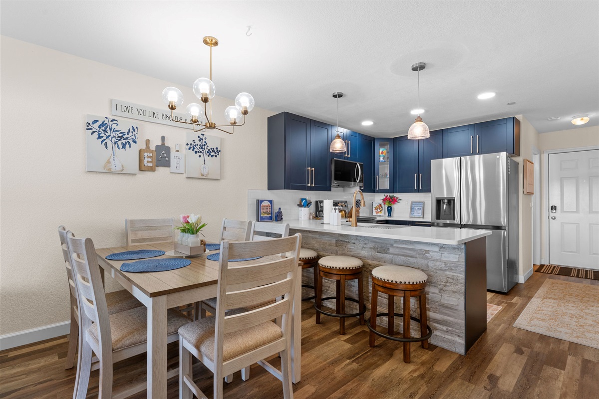 Open kitchen and dining with island seating.
