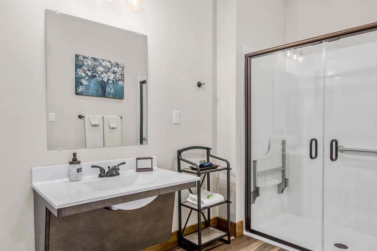 Marilla Cuthbert ADA accessible bathroom with grab bars and wheelchair friendly sink