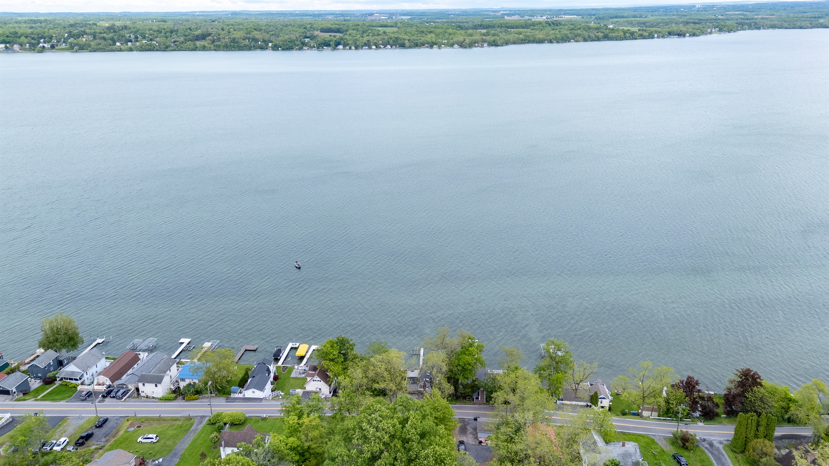 Nestled along a scenic shoreline, this cozy lakefront retreat sits in a charming and peaceful neighborhood 🌳🏘️✨