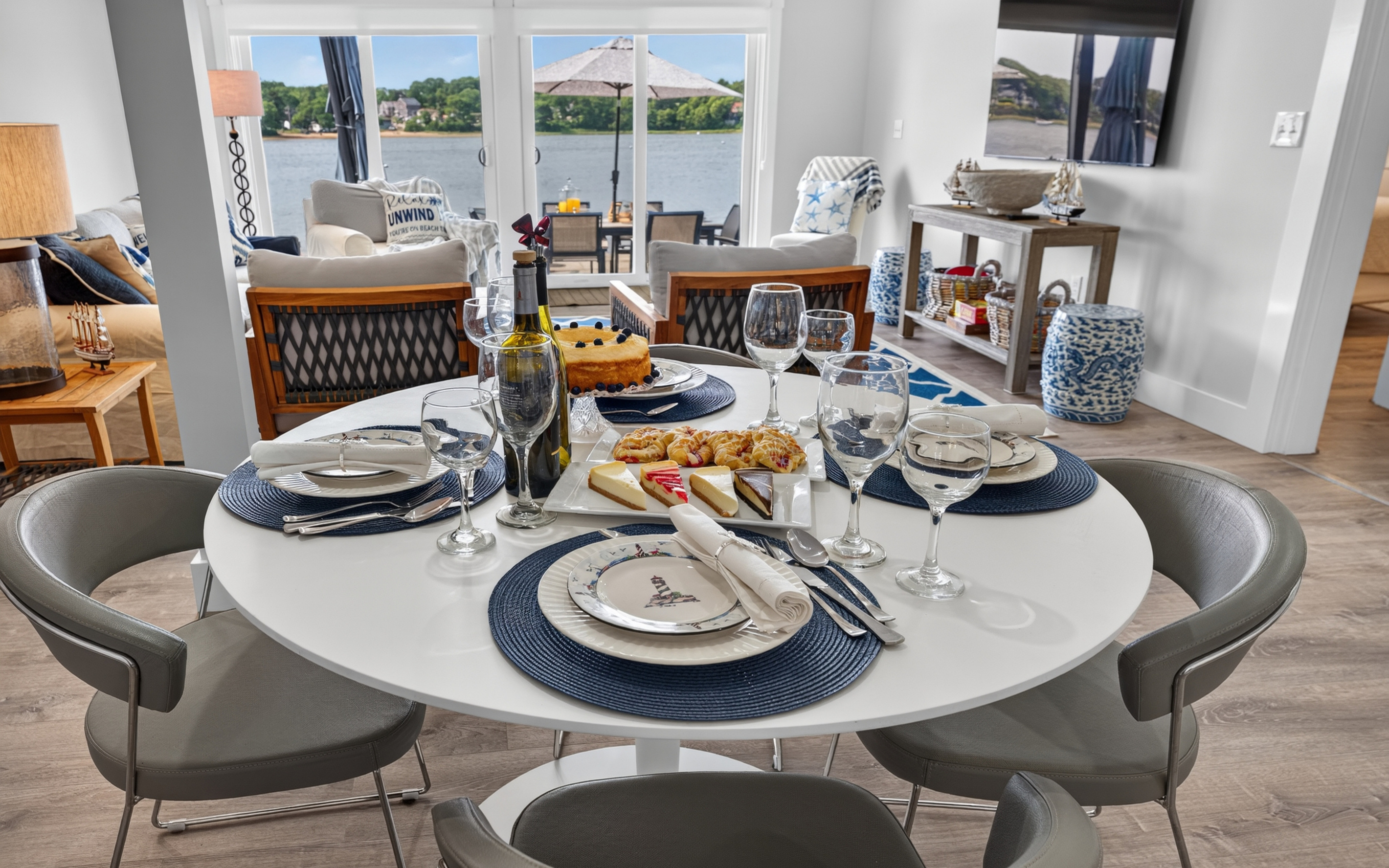 Gather around the dining table with beautiful views of the spacious living area and cozy fireplace.