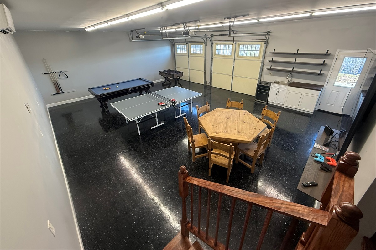 Game Room with all new 8ft pool table, ping pong table, foosball table, professional game table, 75 inch TV with Nintendo 2 player and Nintendo games.  sink & mini-refrig, included