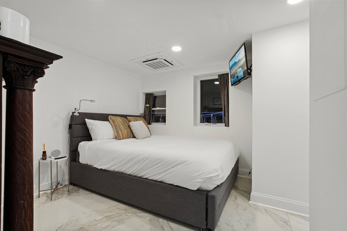 Bedroom #8 on the lower level has a queen bed with a twin trundle underneath, and an en-suite bathroom