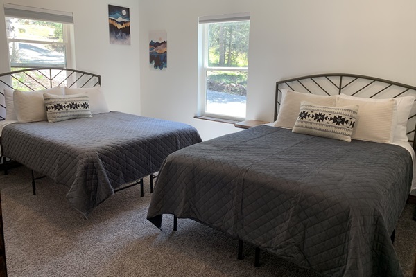 Guest bedroom with two queen beds.