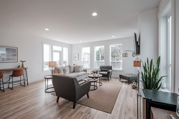 Open-concept layout connects the kitchen, dining, and living areas for easy, comfortable group gatherings. 