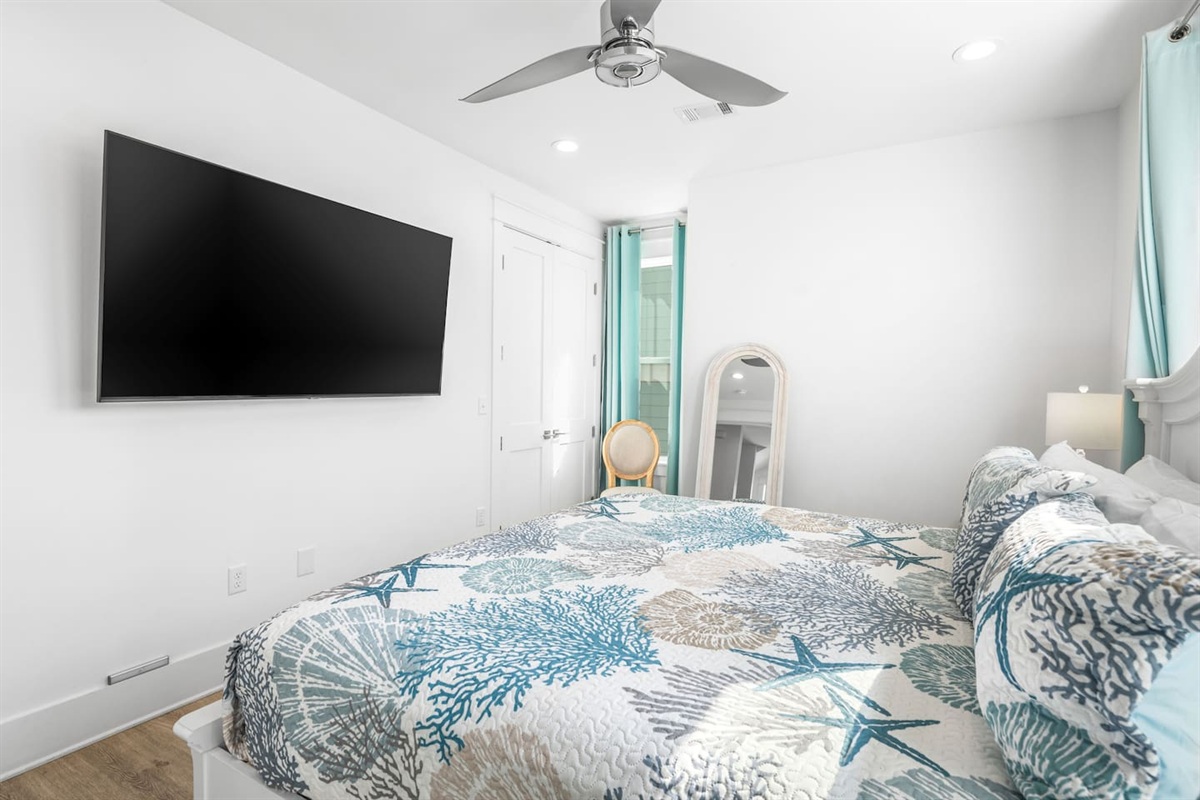 
Luxury Master Retreat: King-sized bed & XL Smart TV for 5-star comfort. Features a stunning 200-year-old antique door with steel partition opening to a sleek, modern bathroom. A unique blend of historic charm & coastal luxury-your beachside oasis!