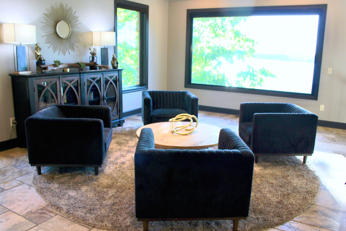The elevated lounge area has four conversation chairs and grand views of the lake.