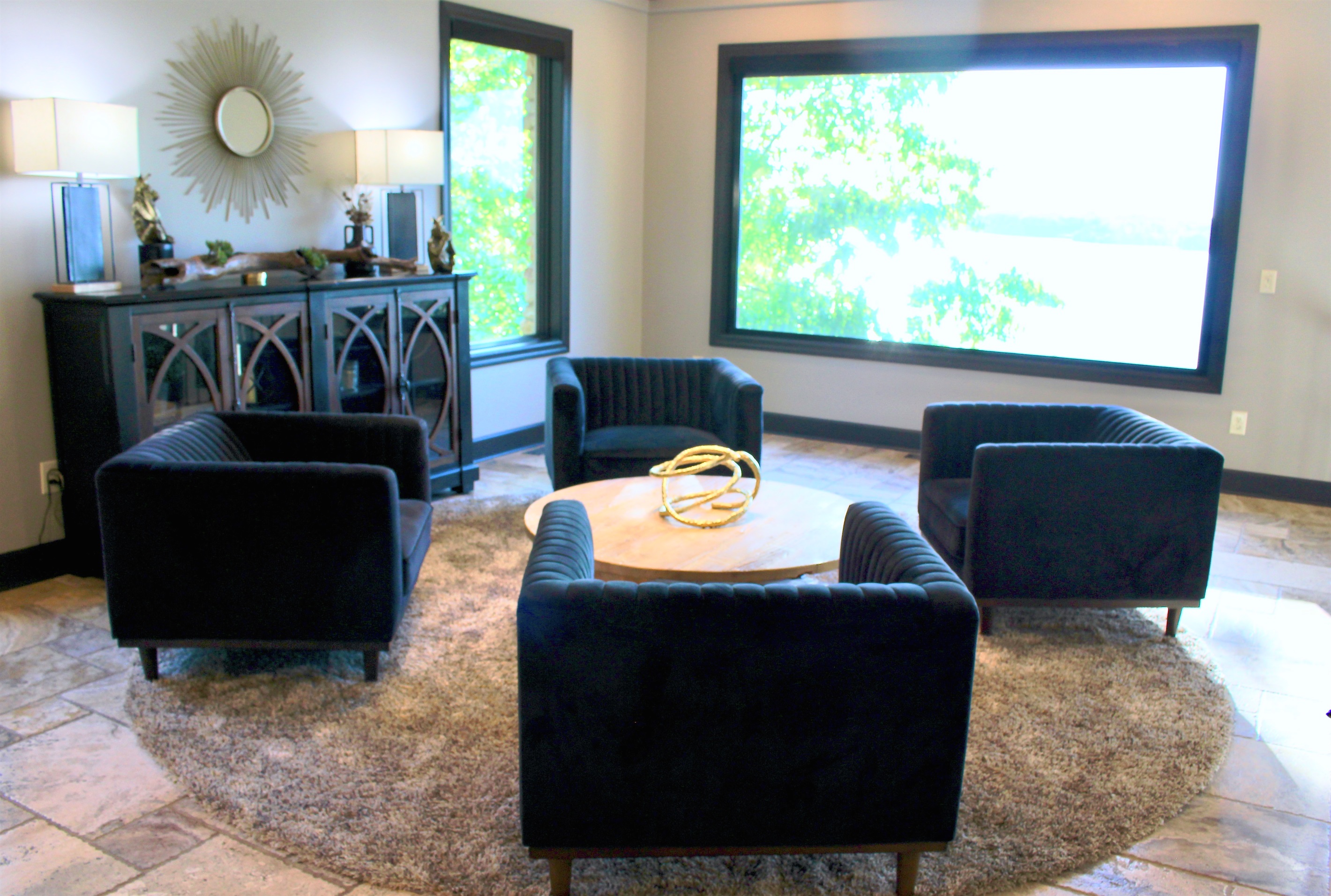 The elevated lounge area has four conversation chairs and grand views of the lake.
