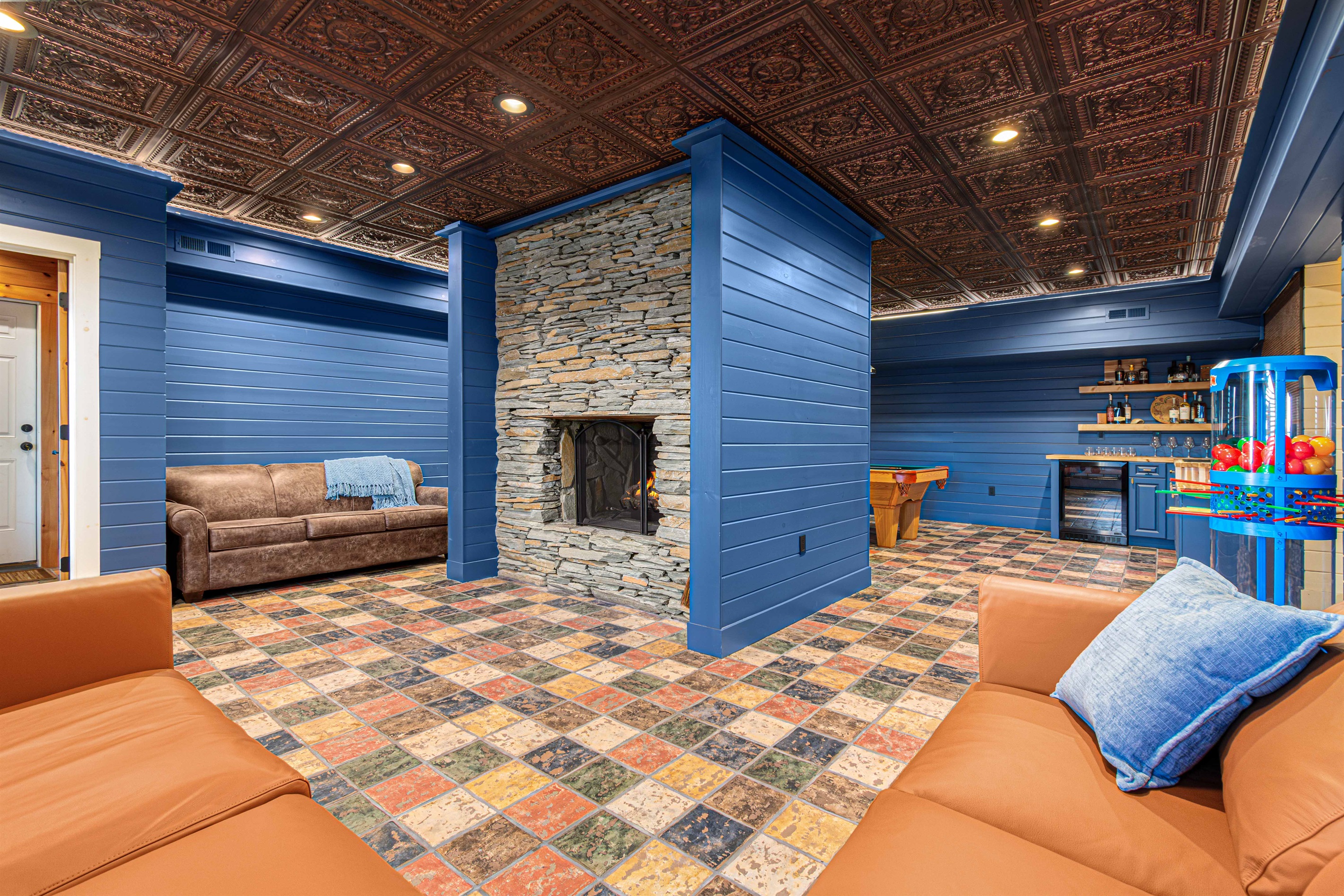 Game Room: Unwind by the fireplace or challenge friends at the pool table in this vibrant retreat!