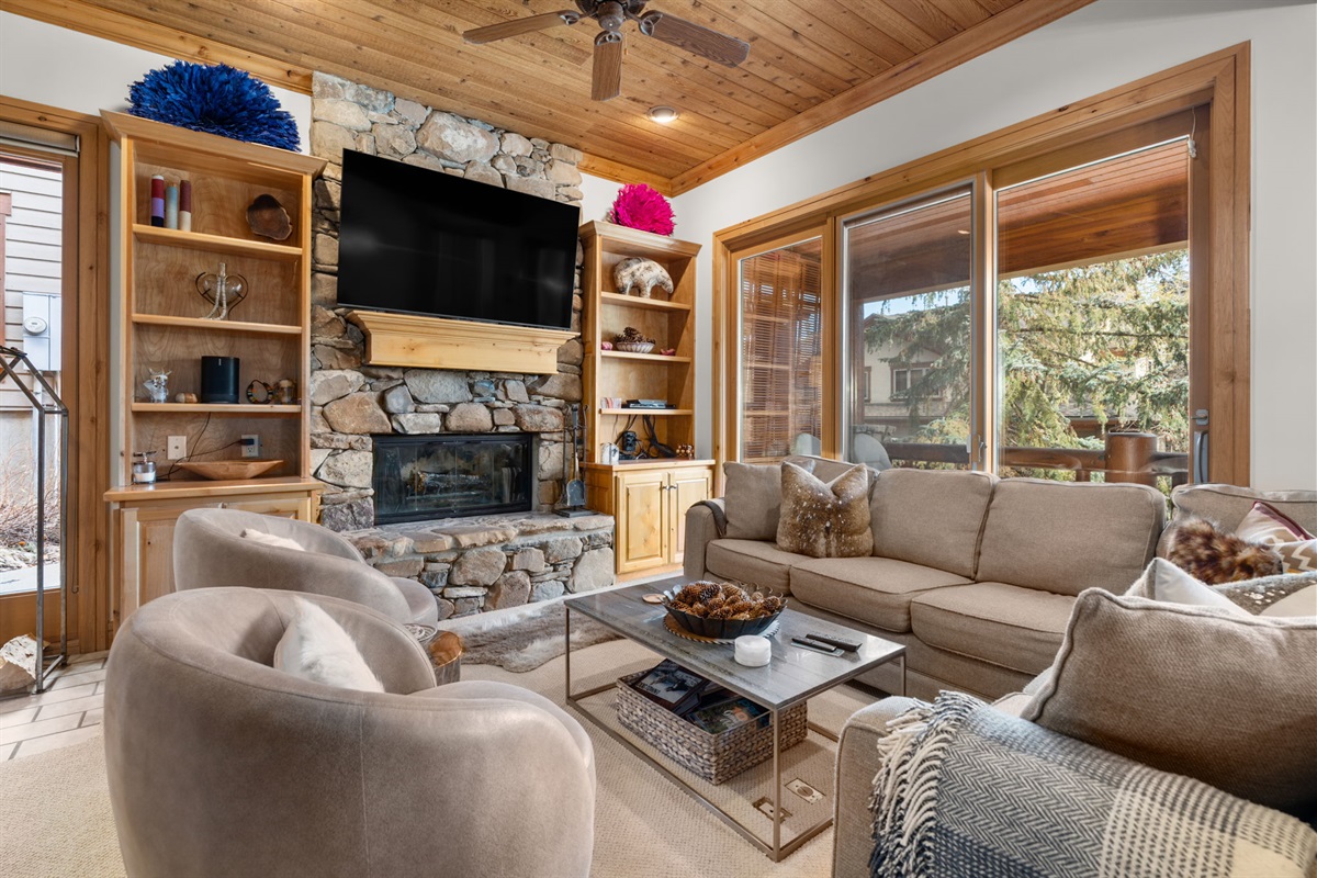 Beautifully appointed living room with real wood fire